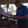 Demonstrating muzzle loading rifle procedures.